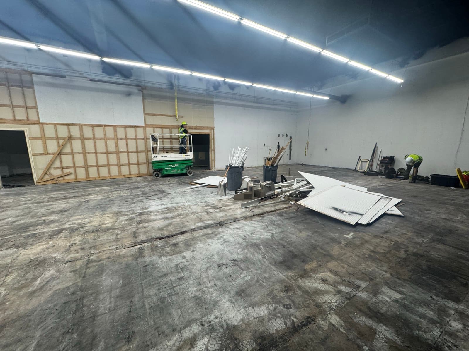 Workers clearing debris during a commercial site cleanup